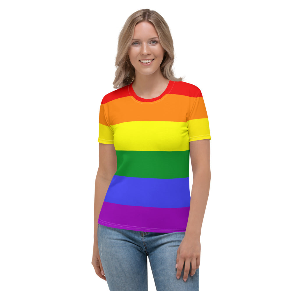 A woman wears a Rainbow Pride Flag Fitted T-shirt by The Rainbow Stores