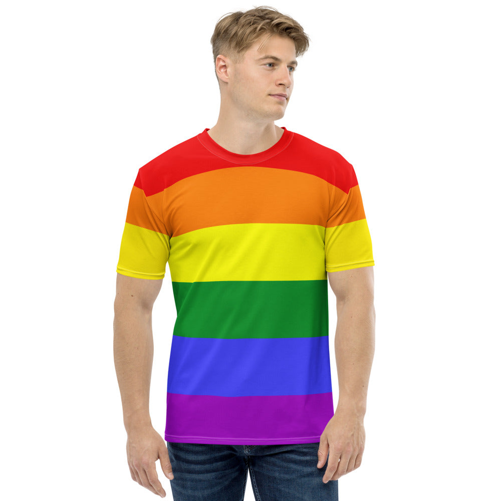 A man wears a Rainbow Pride Flag T-shirt by The Rainbow Stores